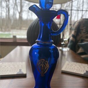 Vintage Avon So Soft empty 6 oz Colbalt Blue and Gold capped bottle.